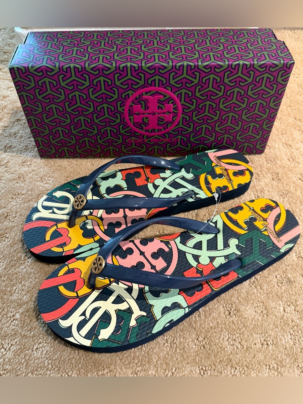 NWT Tory Burch navy printed flip flops with gold logo